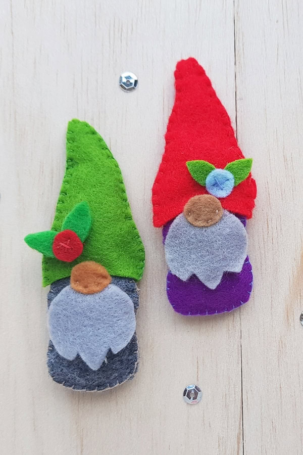 Red and green felt gnome plushies with beards and round noses